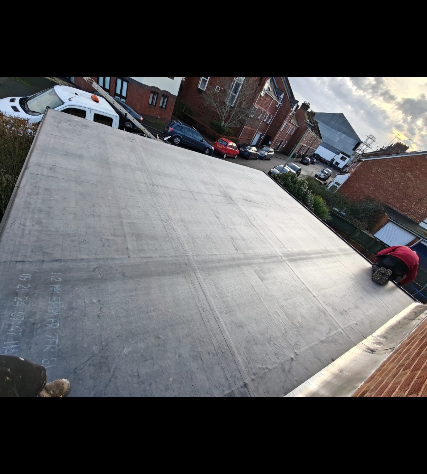 Rubber membrane being installed on a flat roof in Exeter
